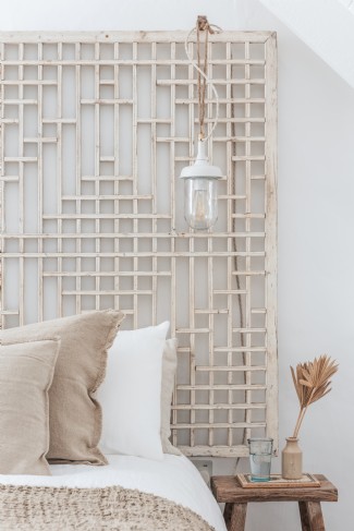 The bedrooms are styled with coastal and vintage reclaimed finds