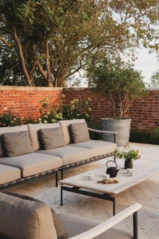 The partially walled garden is designed by Bunny Guinness