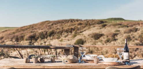 Enjoy leisurely lunches amidst the sand dunes at Holywell Bay