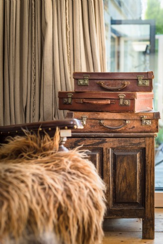 Vintage, treasured, leather suitcases and Nordic sheepskins