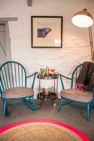 The seating area behind the sofa and TV