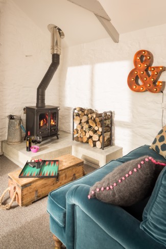 The stylish living area with log burner
