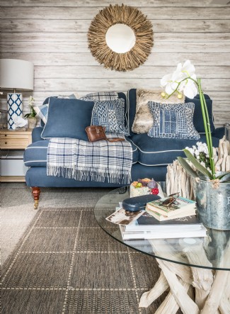 Clapboard walls and calming interiors add waterfront charm to this home