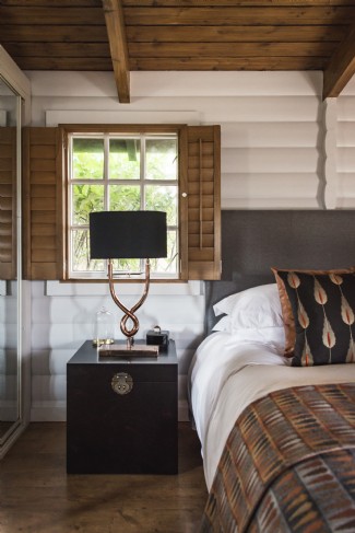 The bedroom features a king-size bed