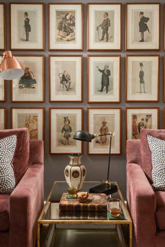 The cinema room exudes a gentleman&acute;s smoking room allure