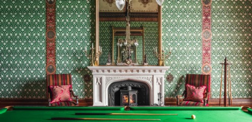 A dramatic backdrop for a game of billiards
