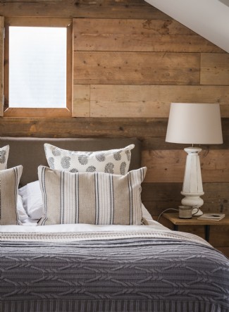 The master bedroom with a feature panelled wall