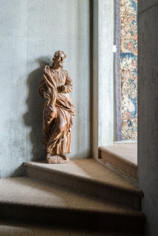 Bespoke artwork against exposed concrete juxtaposes old with new