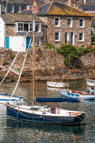 Fishing boats bob quietly on the calm waters of the harbour