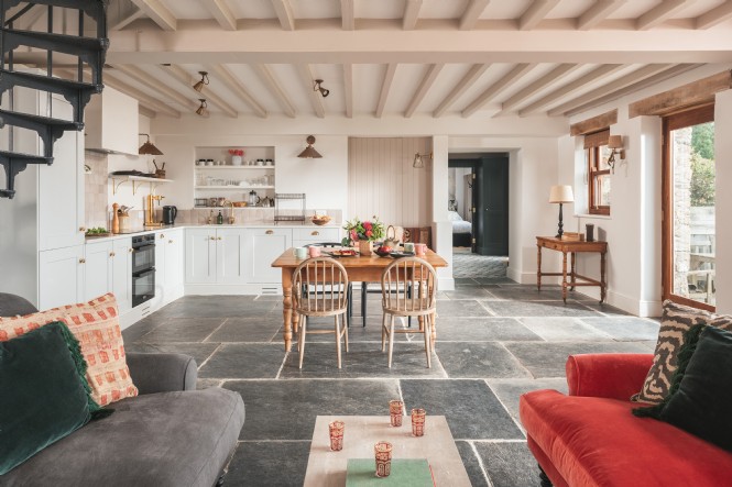 Flagstone flooring and natural material reign supreme at this cottage by the sea