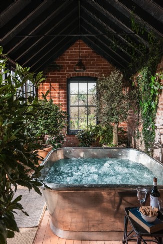 The garden room is in the main house, with a large spa bath hot tub
